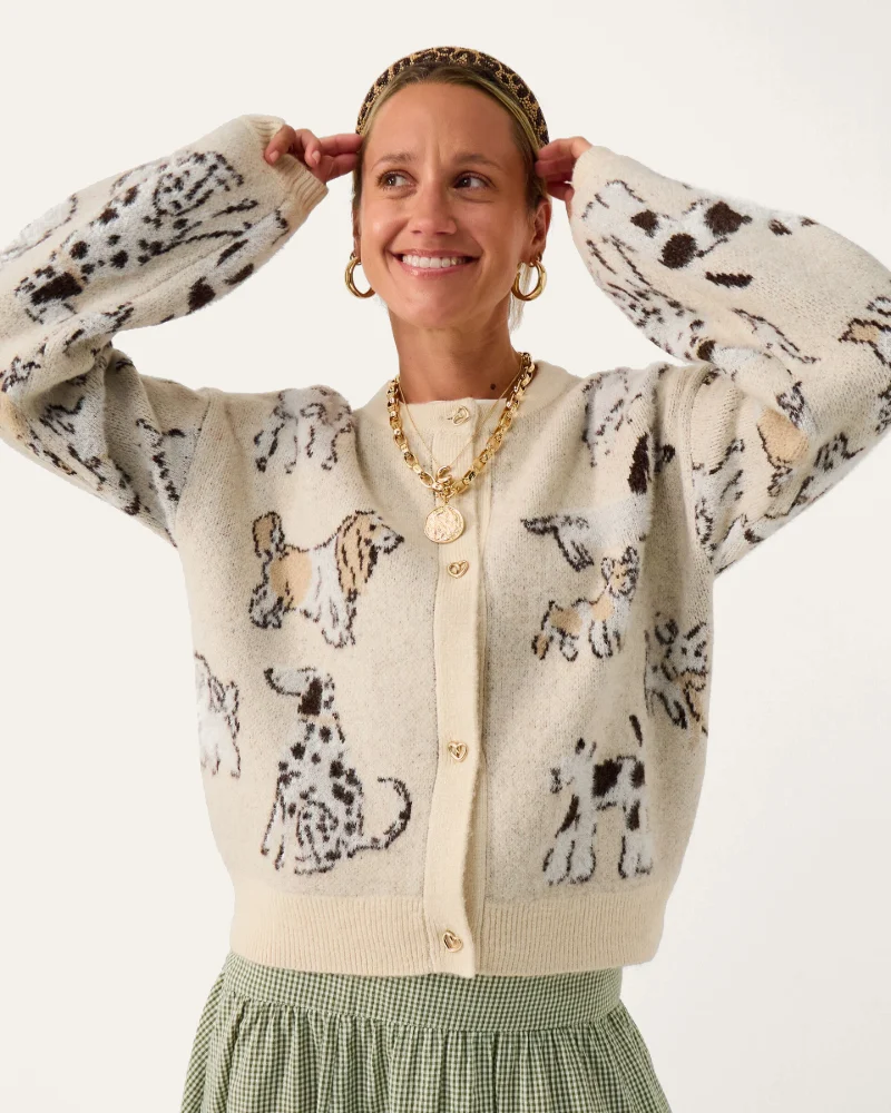 Cream dog-print cardigan with gold hoop earrings, layered chain necklaces and a leopard headband, from Accessorize