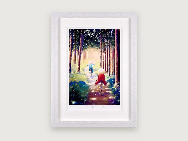 Framed limited edition print, Good Times Ahead: two figures cycling through a sunlit wood