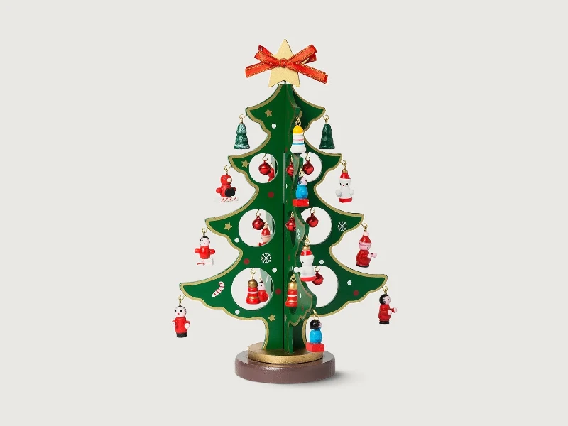 Wooden tabletop Christmas tree with miniature hanging decorations and a gold star
