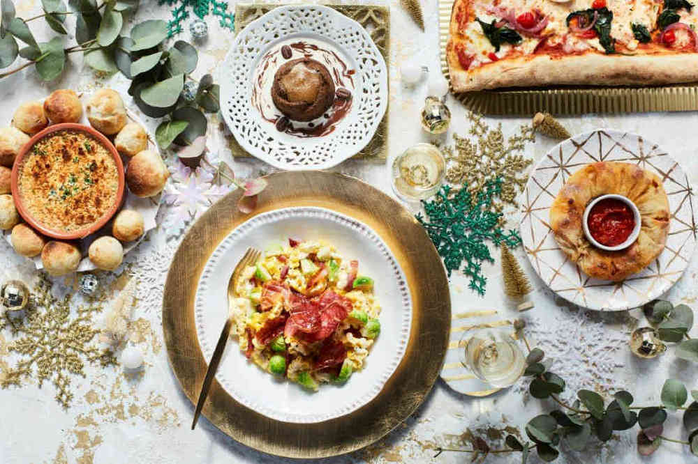 A festive spread at ASK Italian: pasta with pancetta and sprouts, dough balls, a chocolate pudding and pizza
