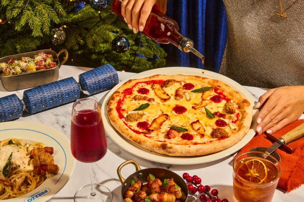 A Prezzo Christmas pizza with carbonara, pigs in blankets and festive drinks