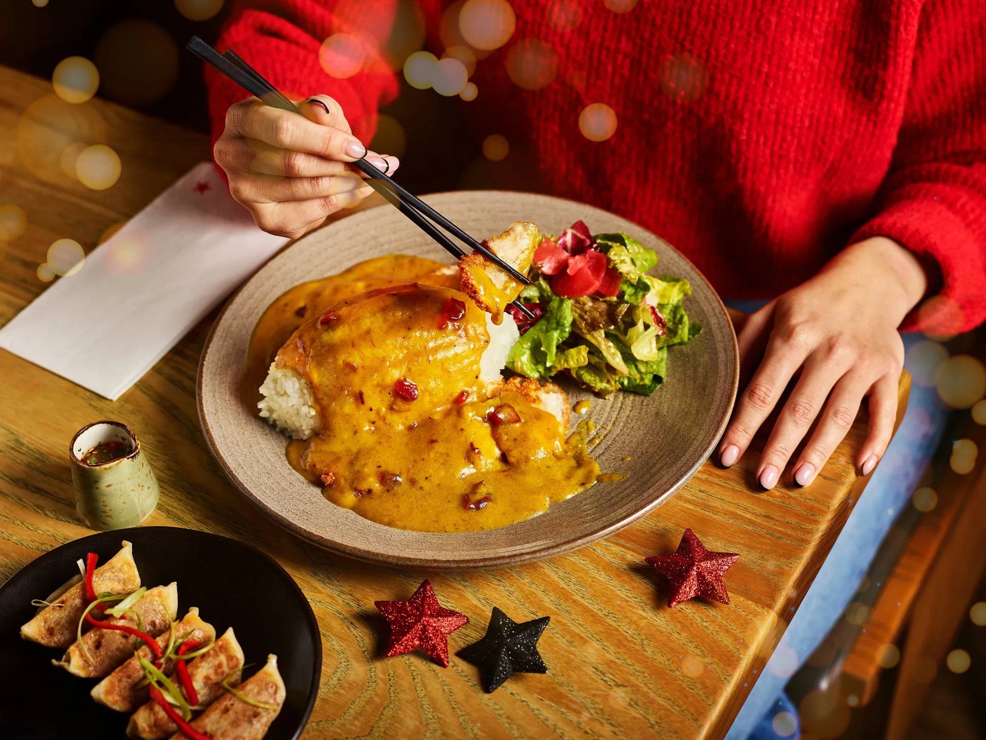 A festive katsu curry and a plate of gyoza at Wagamama