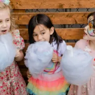 Children enjoying candyfloss