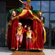 Dress Circle performers emerging from their colourful mobile theatre
