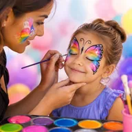 A child having a butterfly painted on her face
