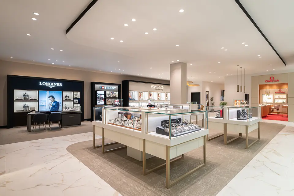 Goldsmiths 82 Bond Street interior with Longines, Tissot and OMEGA displays.
